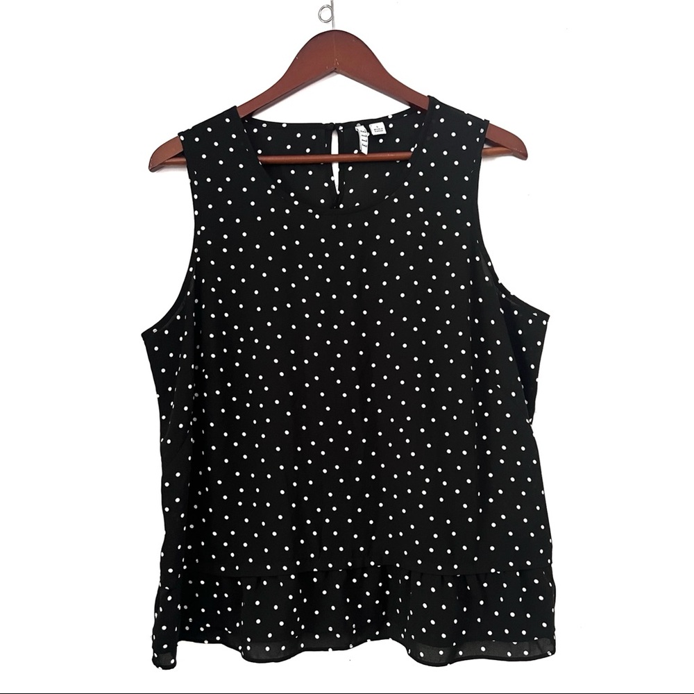 Elle black and white polka dot ruffle bottom top size L